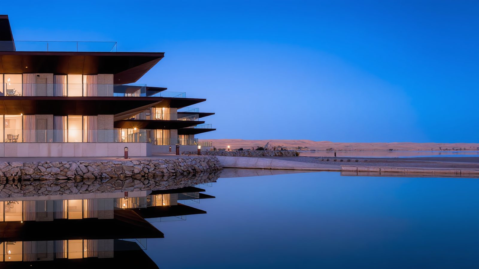 A quay house at dusk, its steps running down to the water